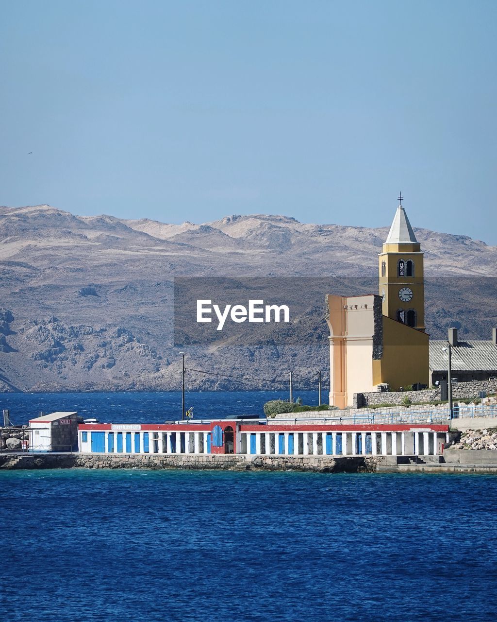 VIEW OF SEA AGAINST BUILDINGS