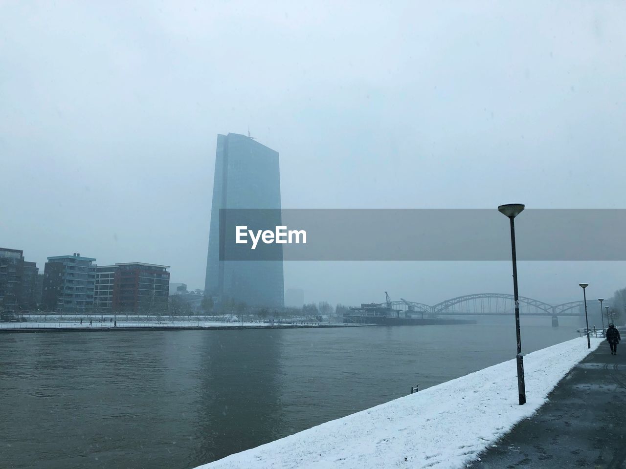 Sea by city against sky during winter in frankfurt