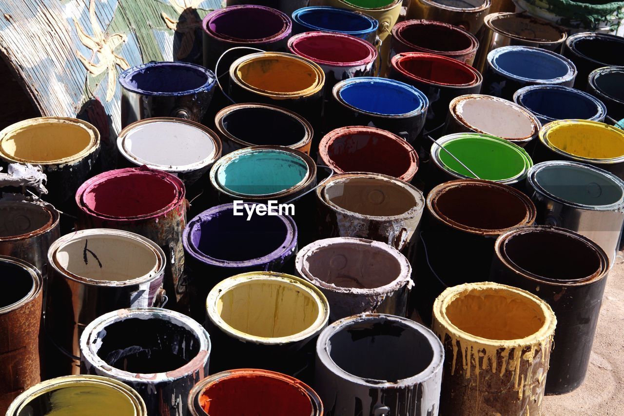 High angle view of multi colored paints for sale at market stall