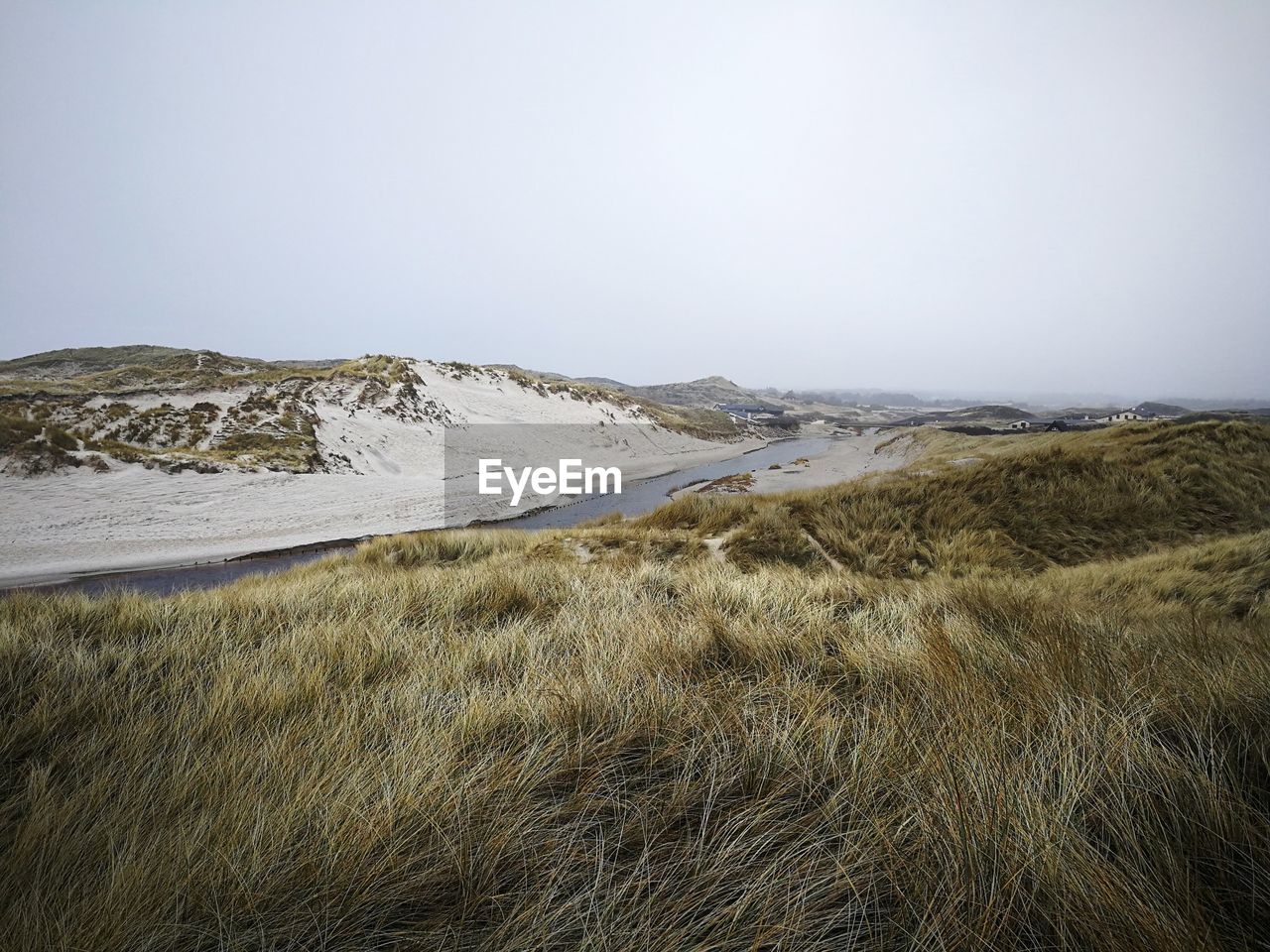 Scenic view of beach against clear sky