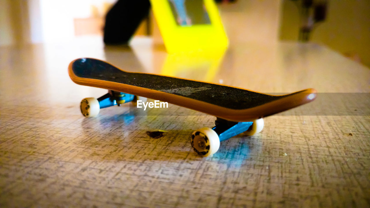 Close-up of skateboard on table at home