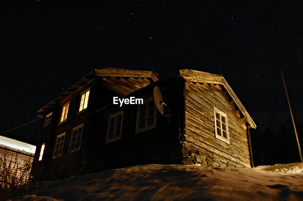 Low angle view of house against sky at night