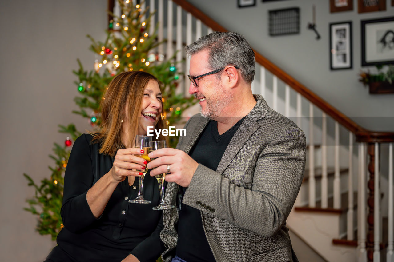 Man and woman toasting glasses