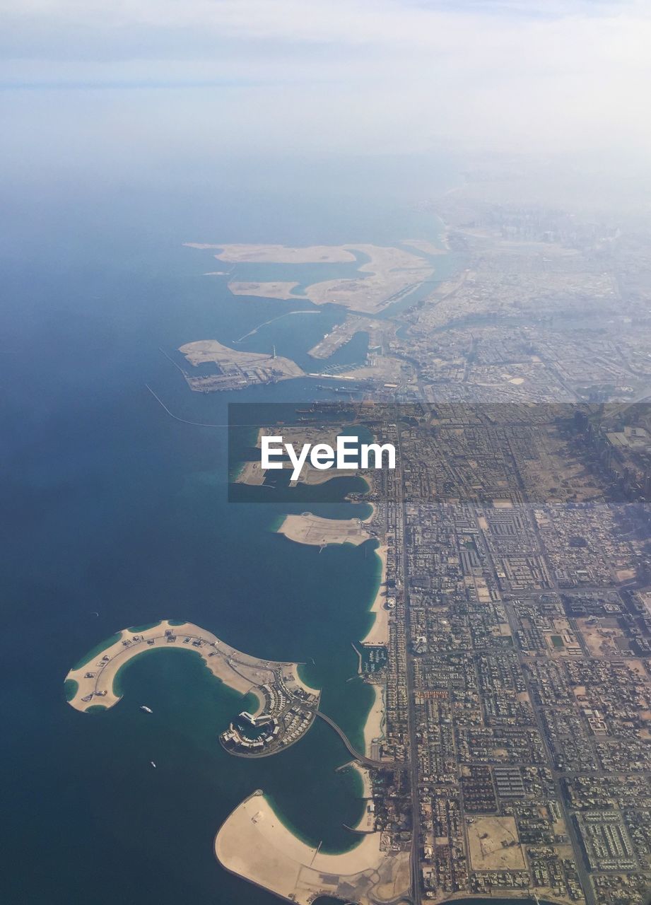 AERIAL VIEW OF SEA AND CITYSCAPE