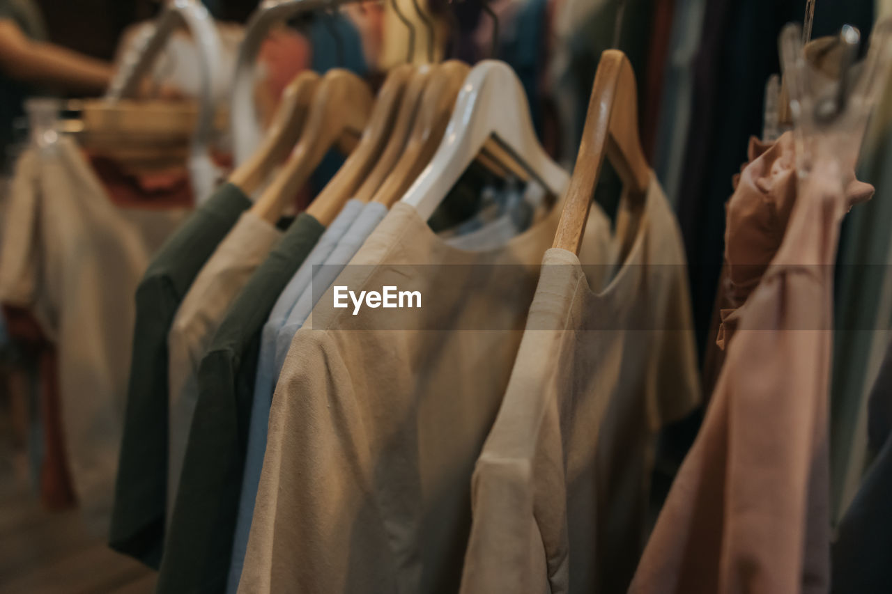 PANORAMIC VIEW OF CLOTHES HANGING ON RACK