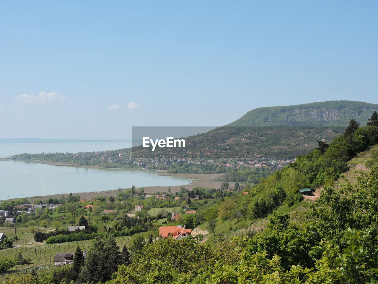 Scenic view of sea and mountains against sky