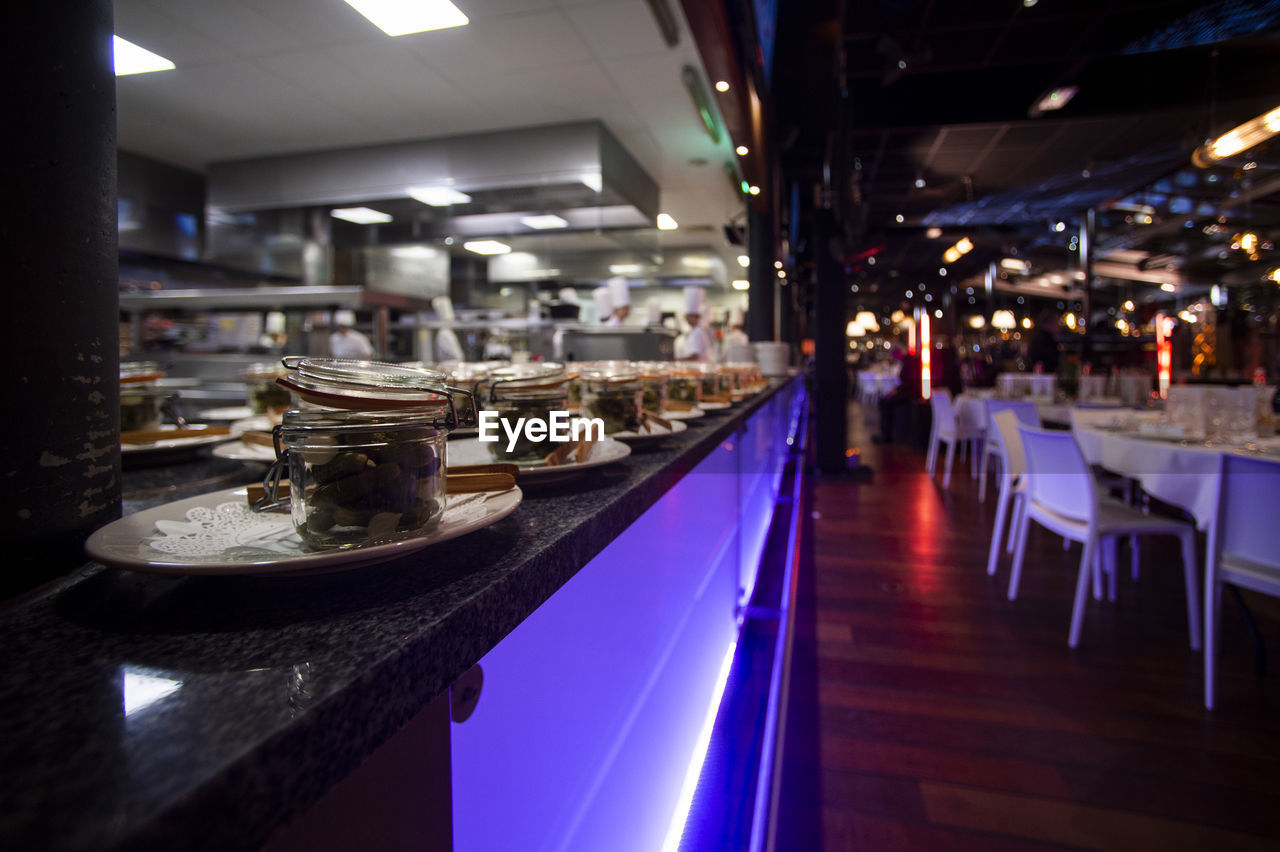 PANORAMIC VIEW OF RESTAURANT AND CHAIRS AT MARKET STALL