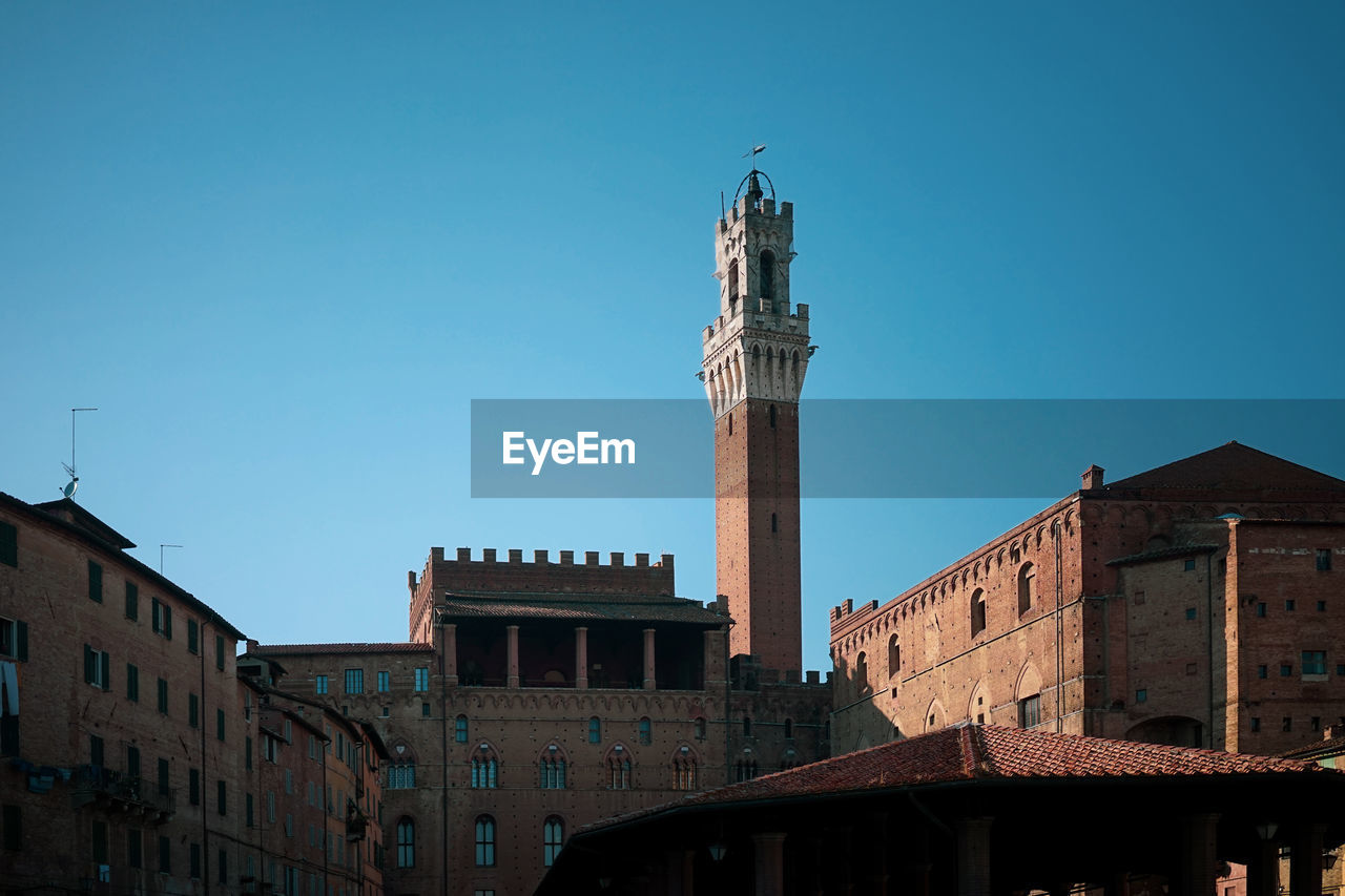 Tower of mangia, pubblico palace, piazza del campo, siena, italy