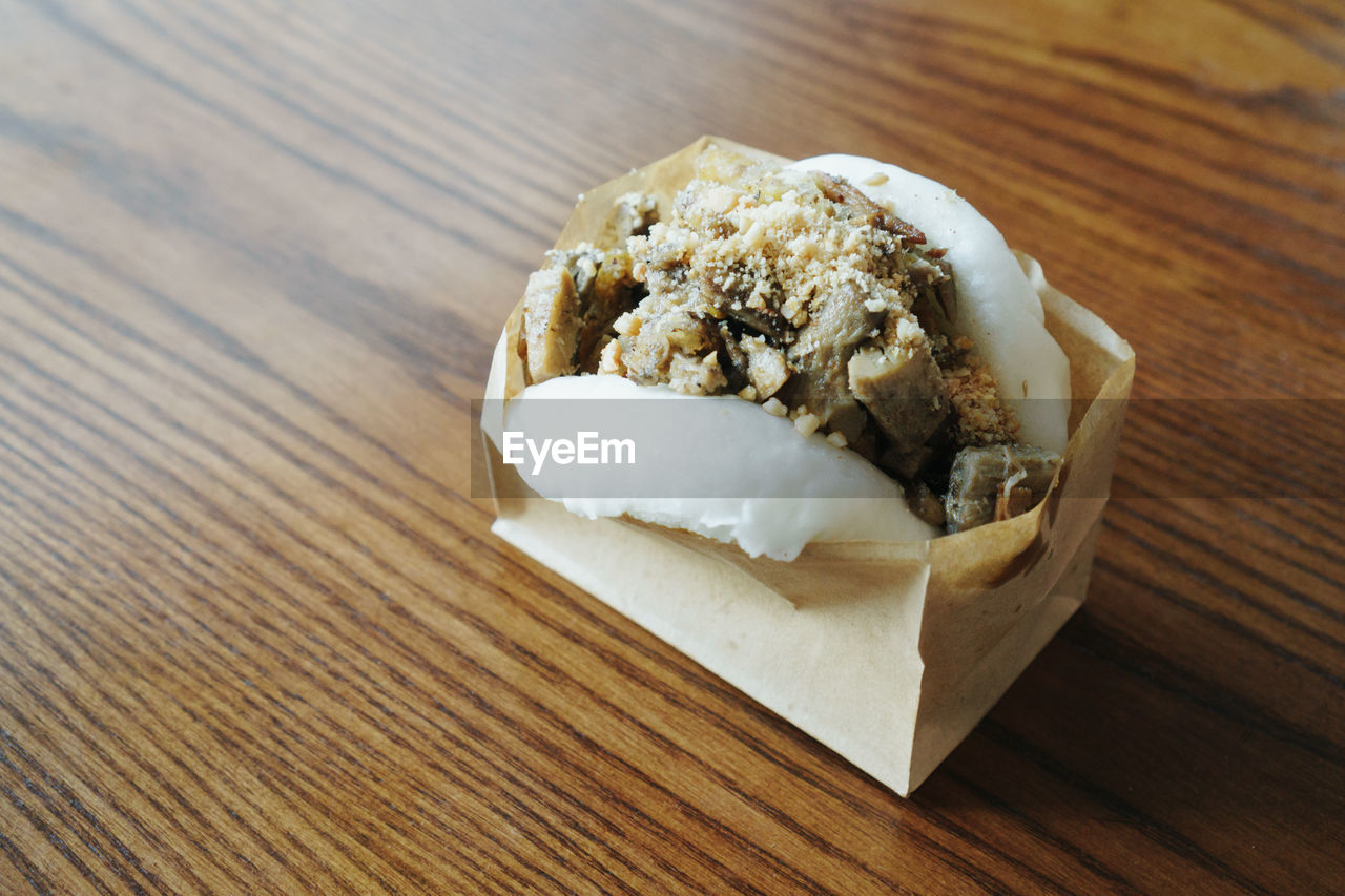 Traditional steamed asian bao buns in paper bag