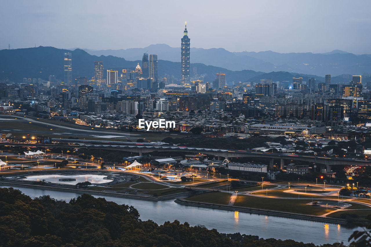 High angle view of illuminated buildings in city