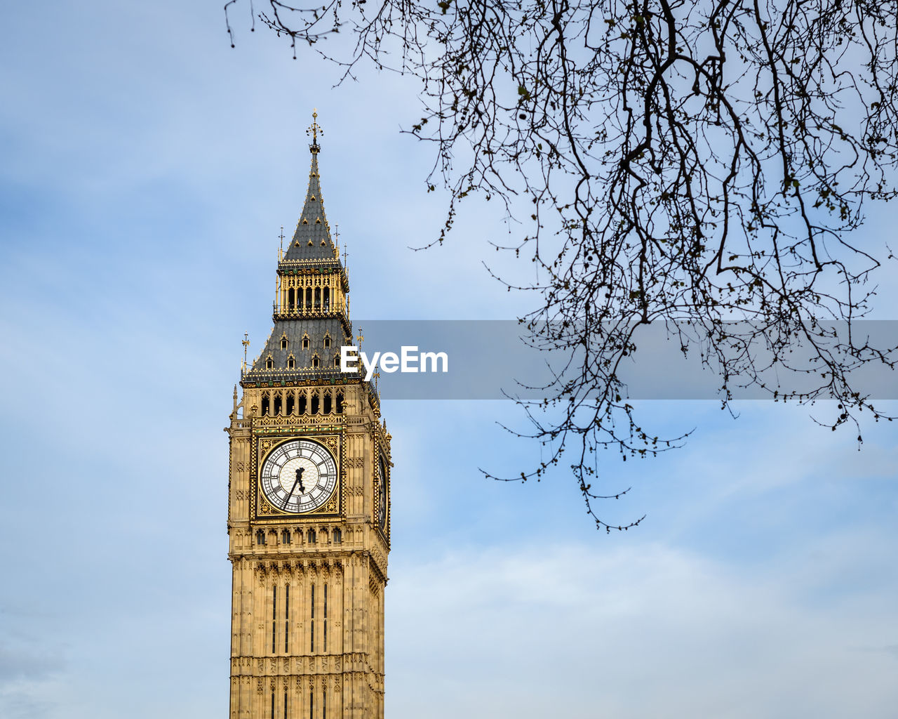 Low angle view of clock tower against sky