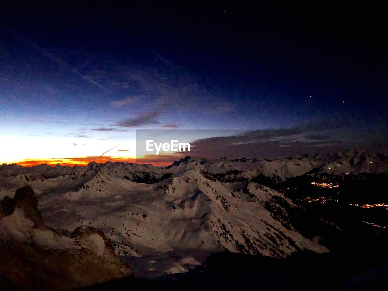 SCENIC VIEW OF MOUNTAIN AGAINST SKY AT SUNSET