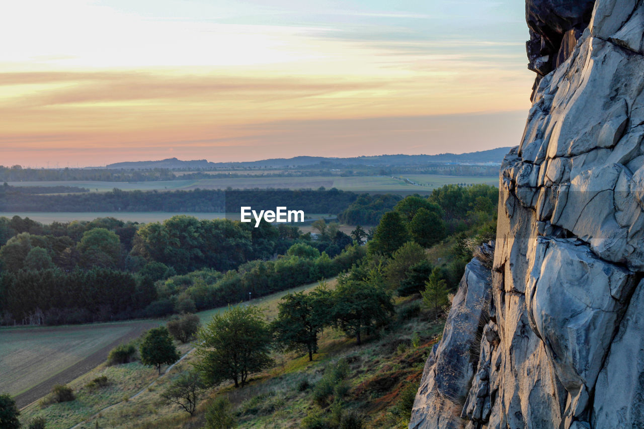 Scenic view of landscape against sky during sunset