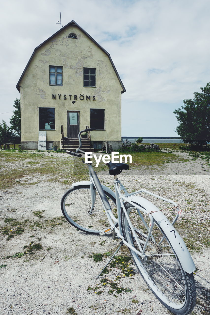 BICYCLE PARKED OUTSIDE HOUSE