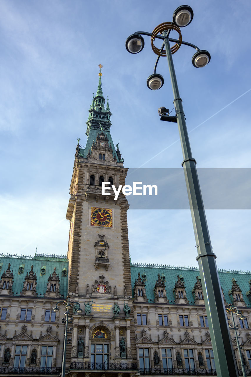 LOW ANGLE VIEW OF CLOCK TOWER IN CITY