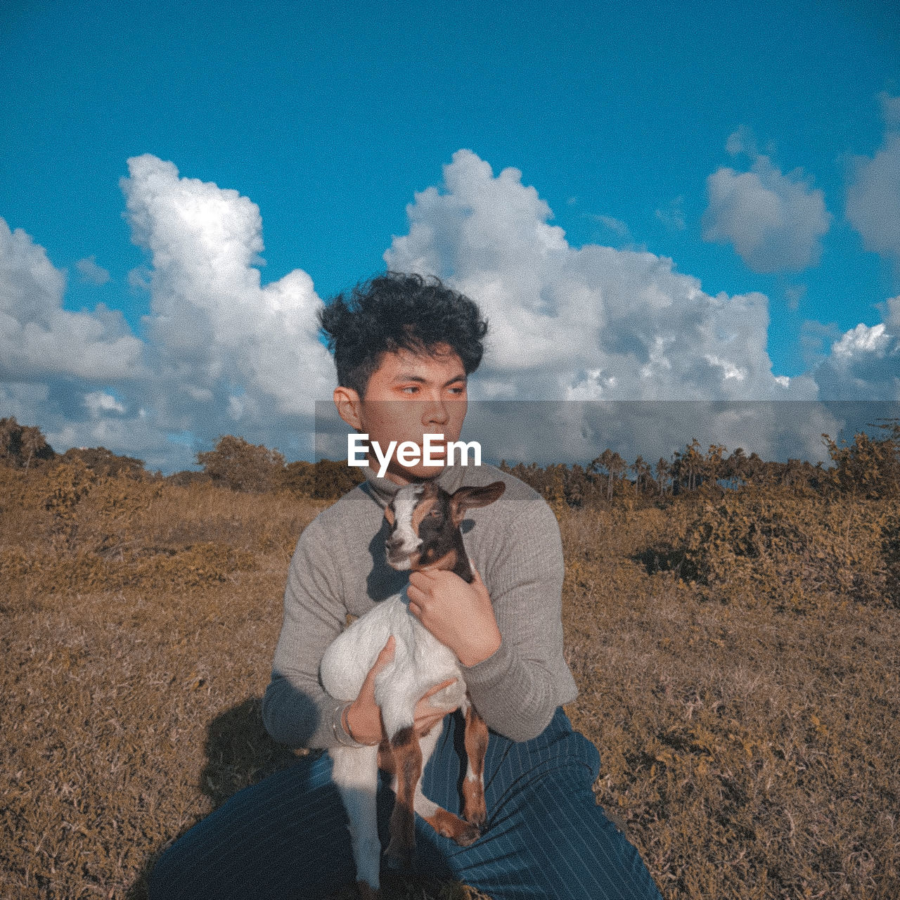 Holding a goat