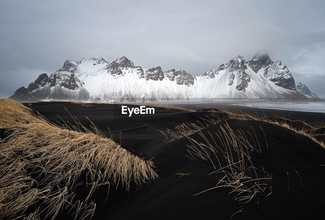 Scenic view of snowcapped mountains against sky