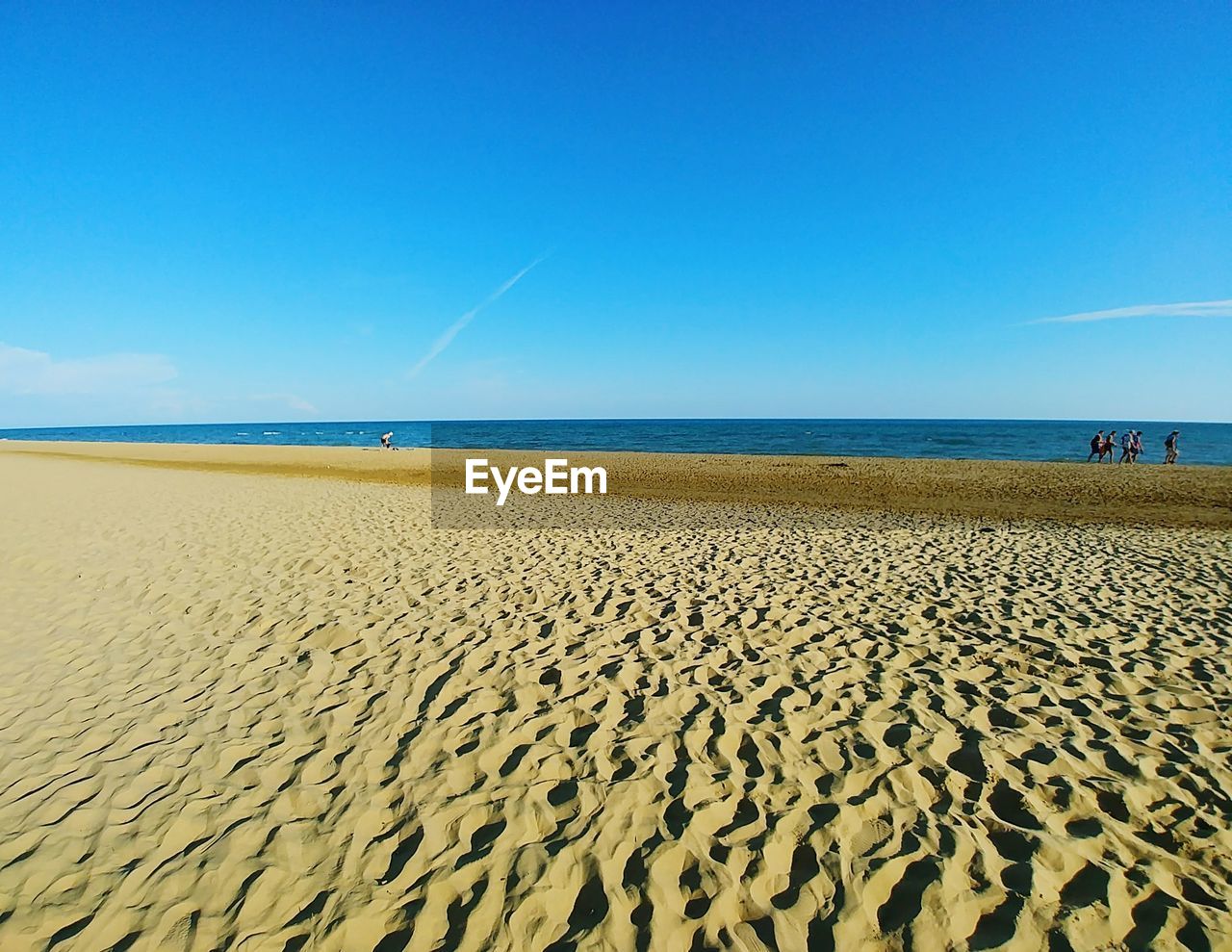 SCENIC VIEW OF BEACH AGAINST BLUE SKY