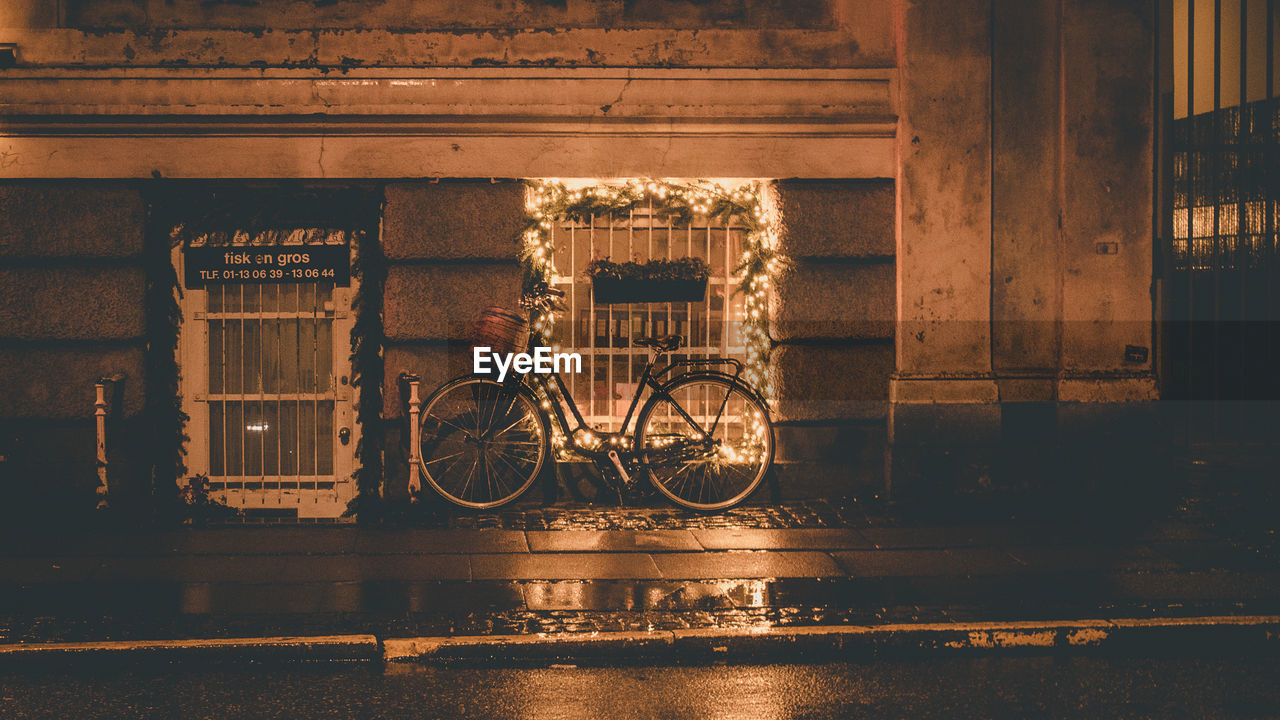 BICYCLE PARKED BY WATER