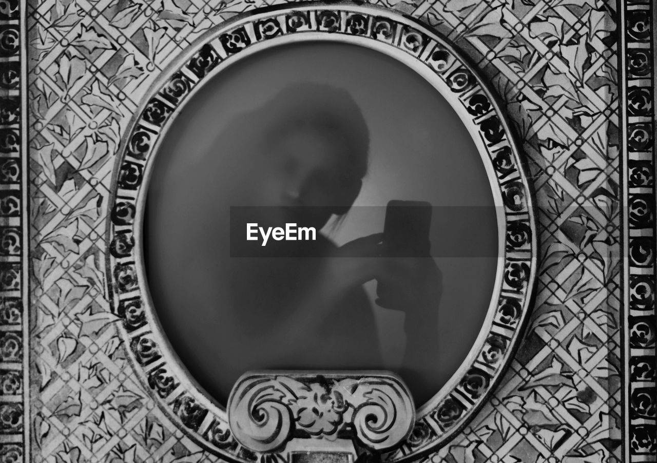Reflection of woman in mirror