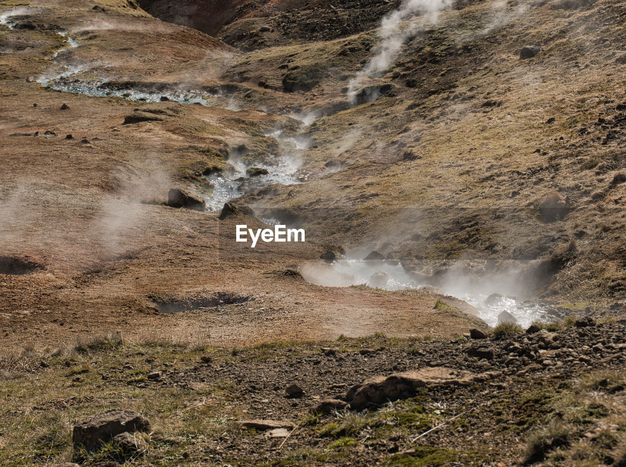 WATER FLOWING THROUGH ROCKS IN LAND