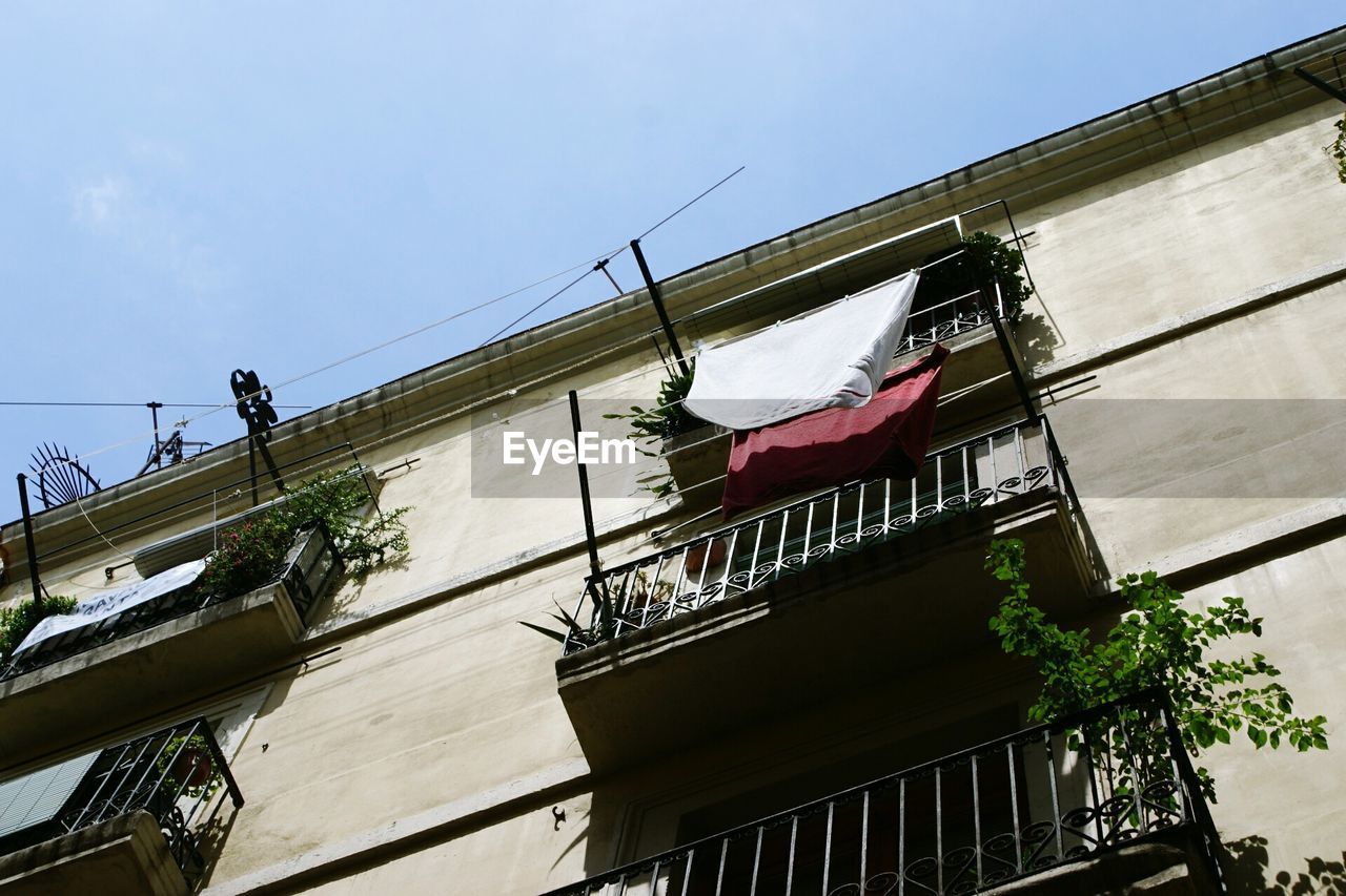 Low angle view of clothesline in balcony