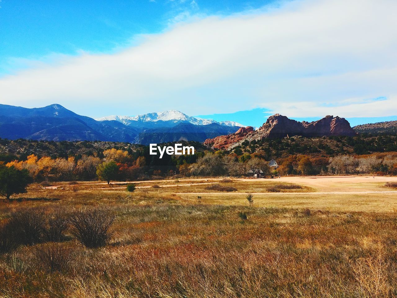 Scenic view of mountains against cloudy sky