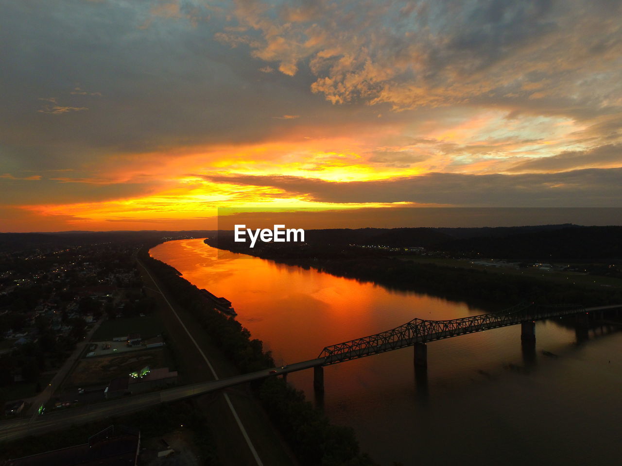 High angle view of robert c byrd bridge over ohio river against orange sky
