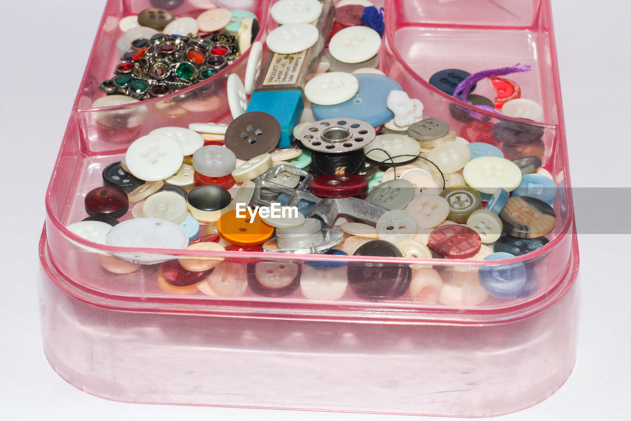 HIGH ANGLE VIEW OF MULTI COLORED TABLE IN BOX