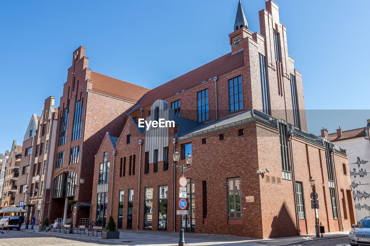 Low angle view of building against blue sky