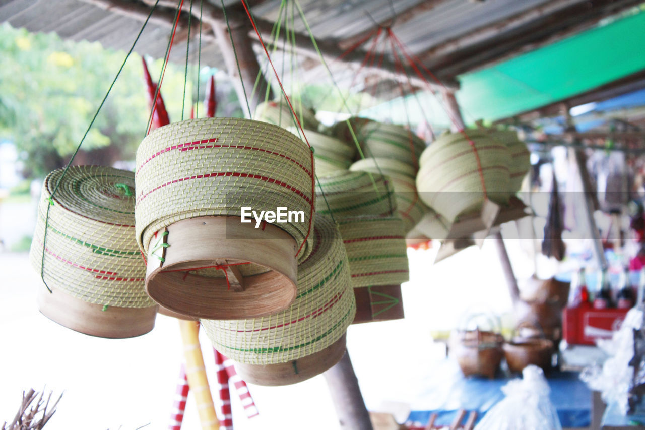 Low angle view of wicker baskets in market for sale