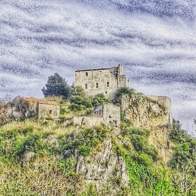 OLD RUINS AGAINST CLOUDY SKY