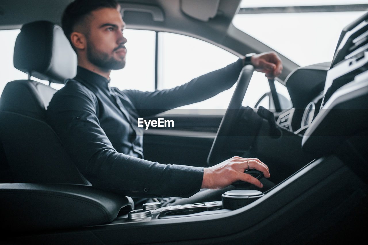 rear view of man sitting in car