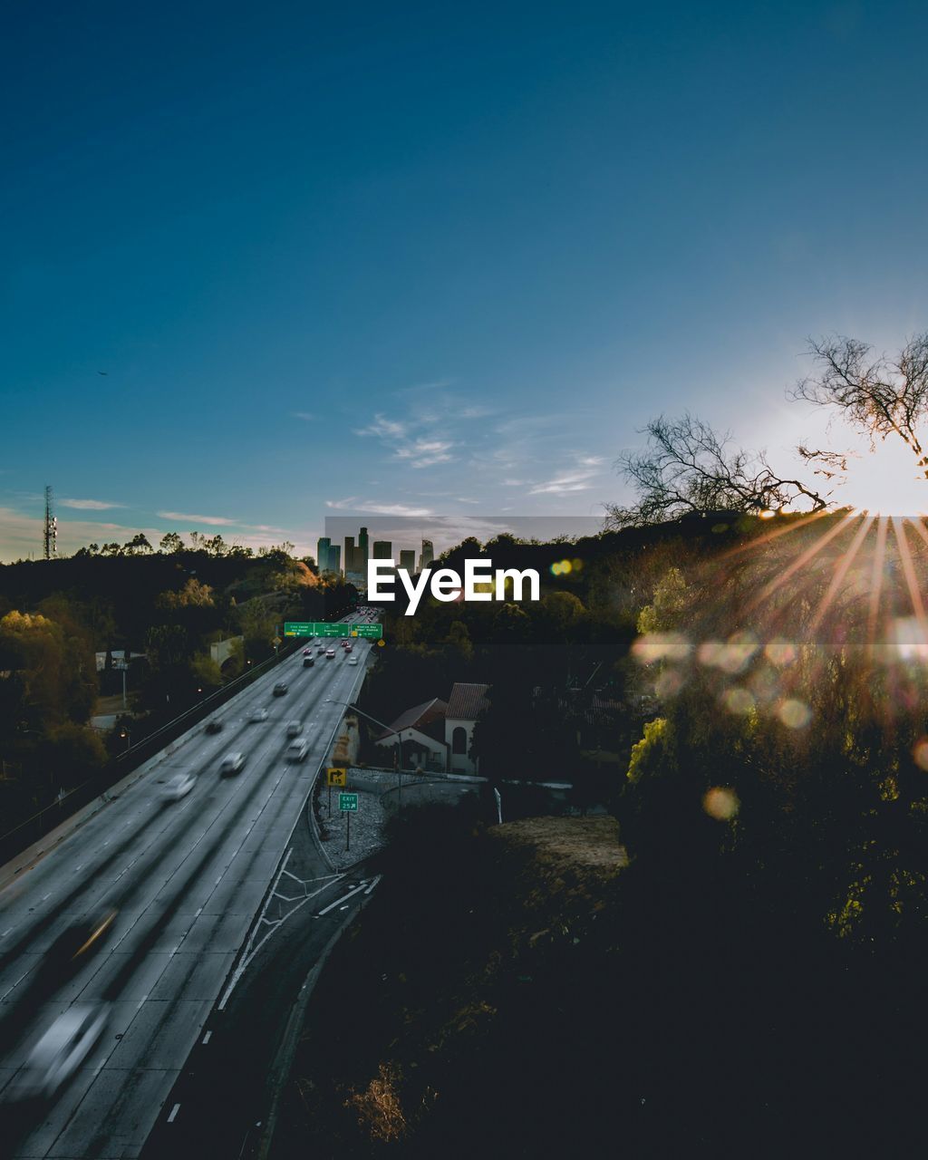 ROAD IN CITY ON SUNNY DAY