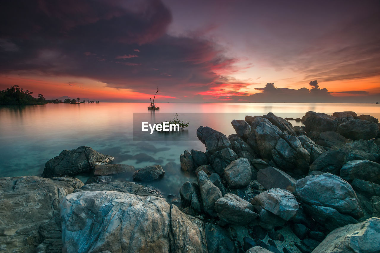 Scenic view of sea against sky during sunset