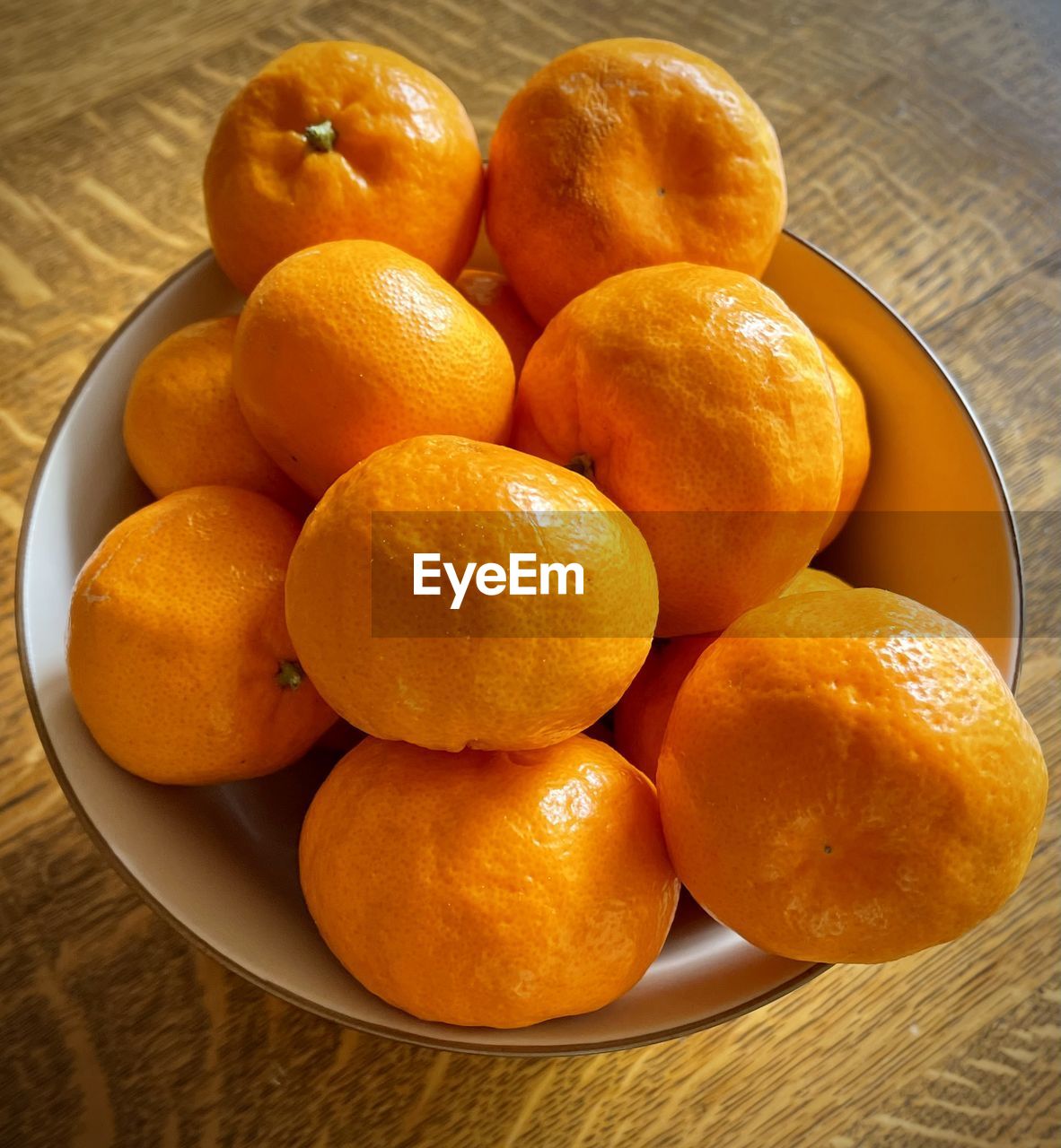 High angle view of mandarins in bowl on table