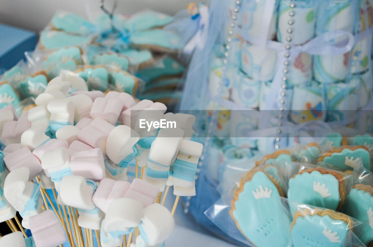 Close-up of marshmallows and cakes for sale in store