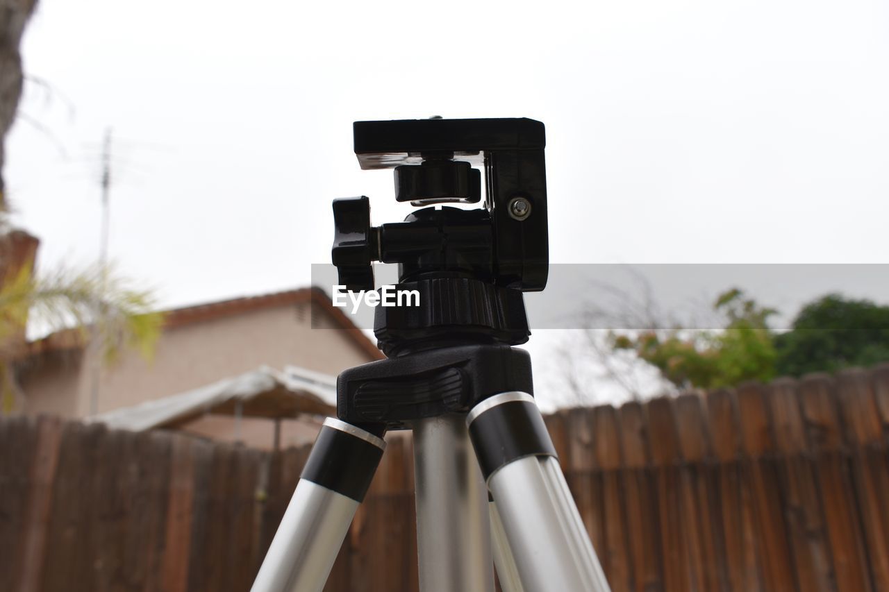 Close-up on camera tripod .