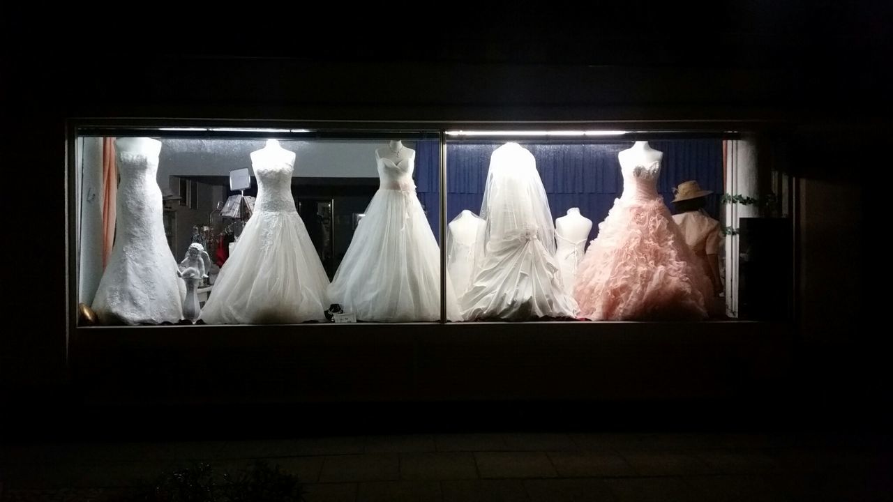 Wedding dress on display in bridal shop window