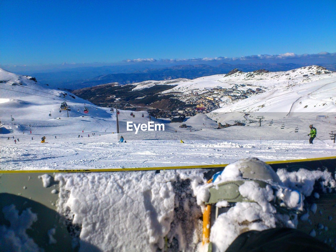 Scenic view of snowcapped mountains against clear blue sky