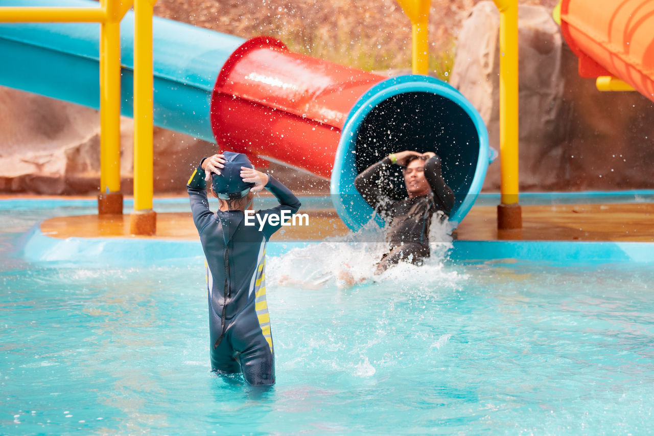 People enjoying in swimming pool