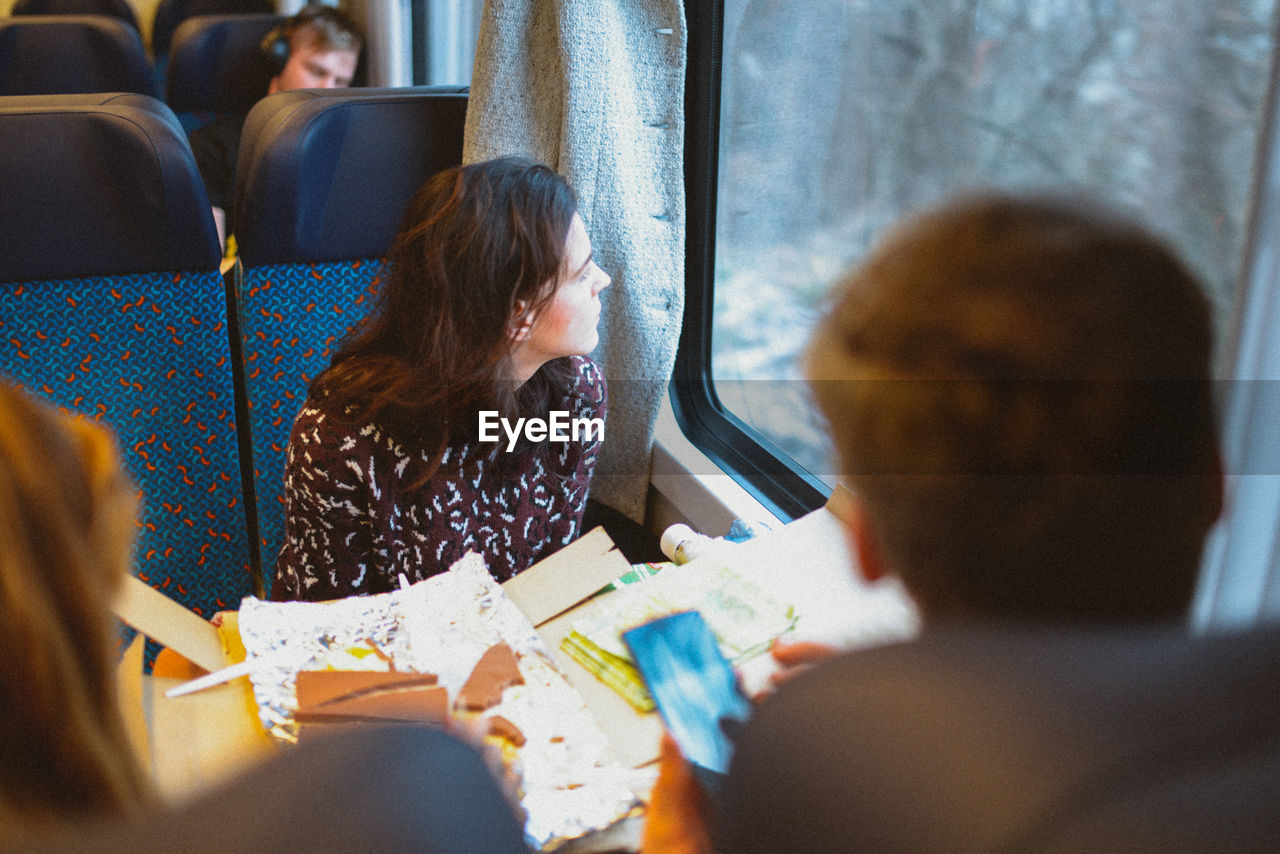 View of people riding in train