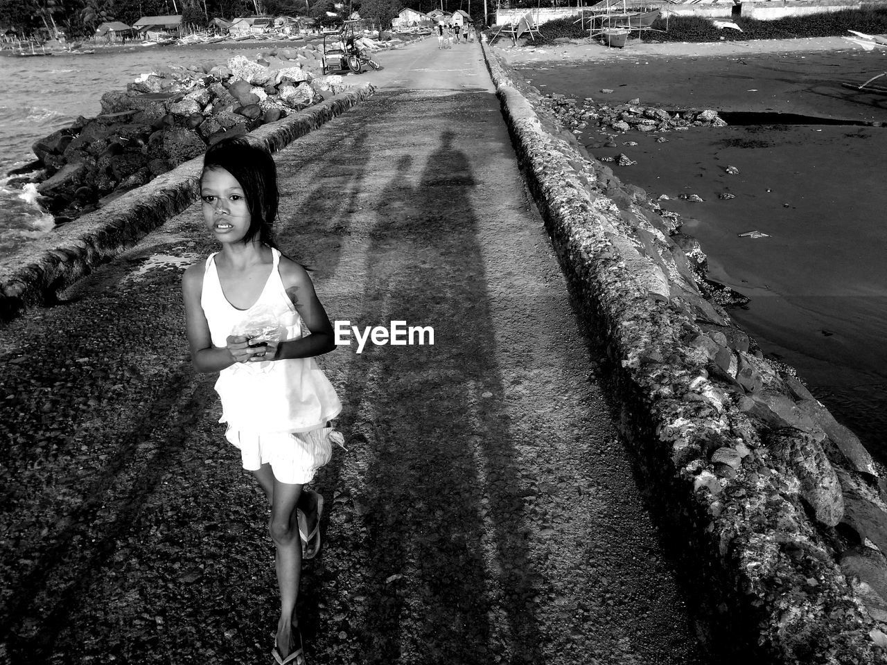 Girl walking on road