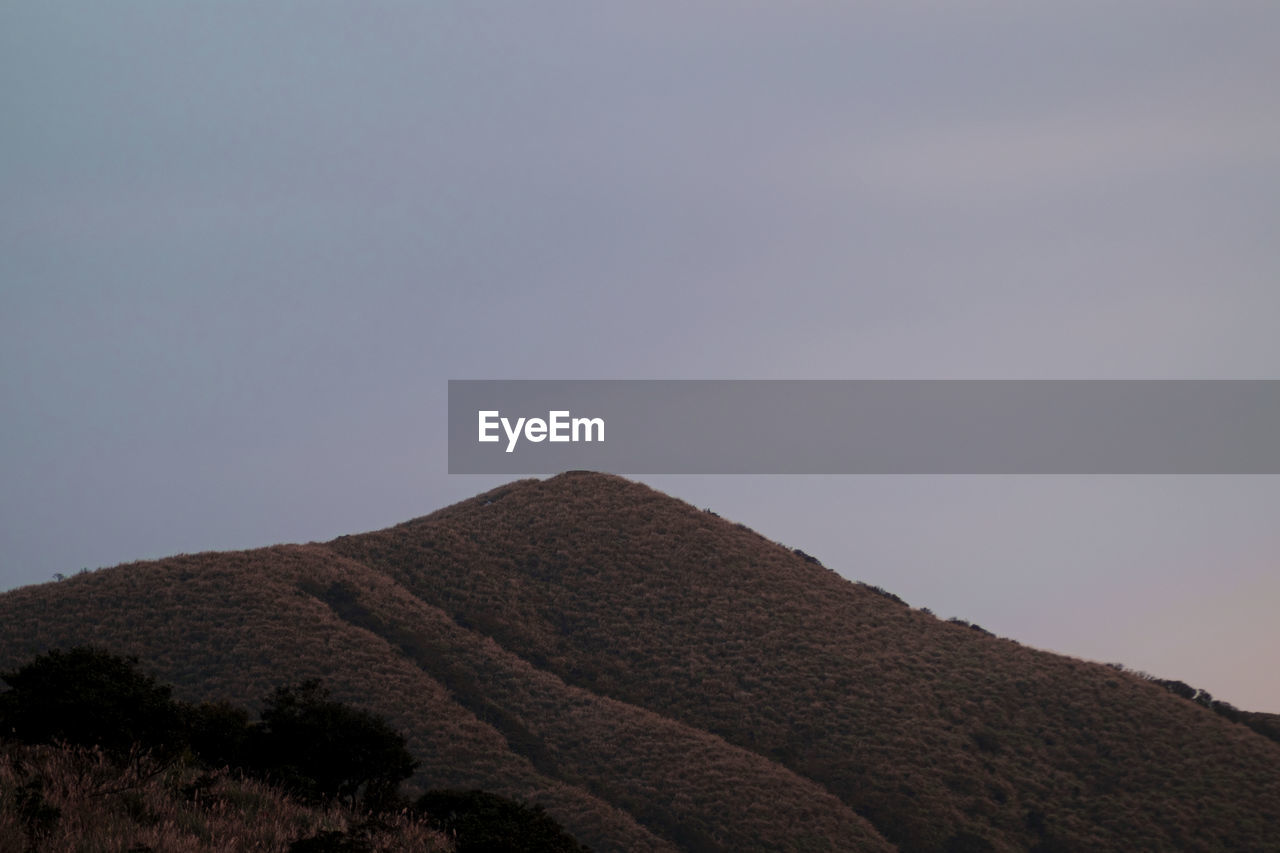 LOW ANGLE VIEW OF LAND AGAINST CLEAR SKY