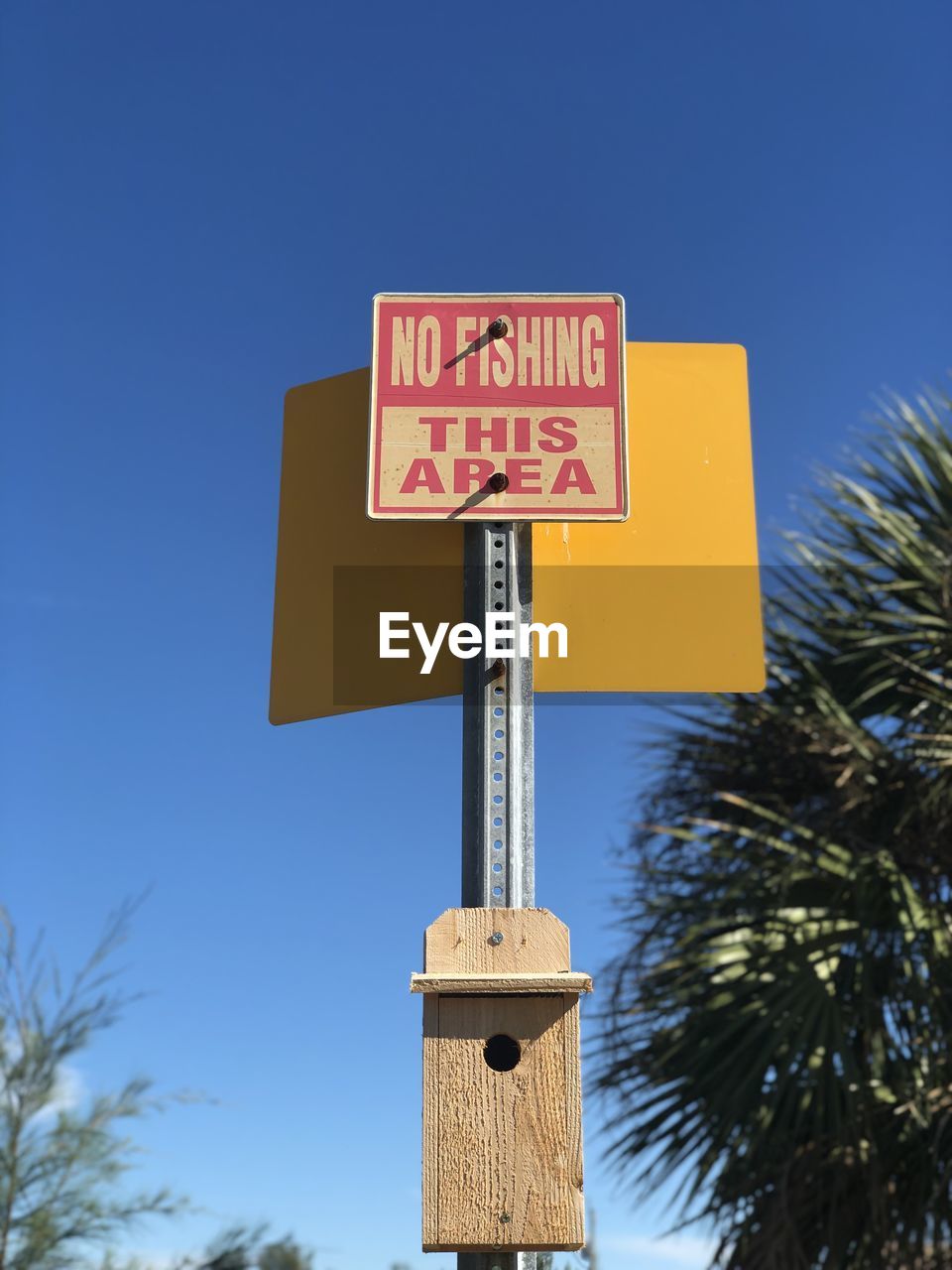 LOW ANGLE VIEW OF ROAD SIGN AGAINST CLEAR SKY