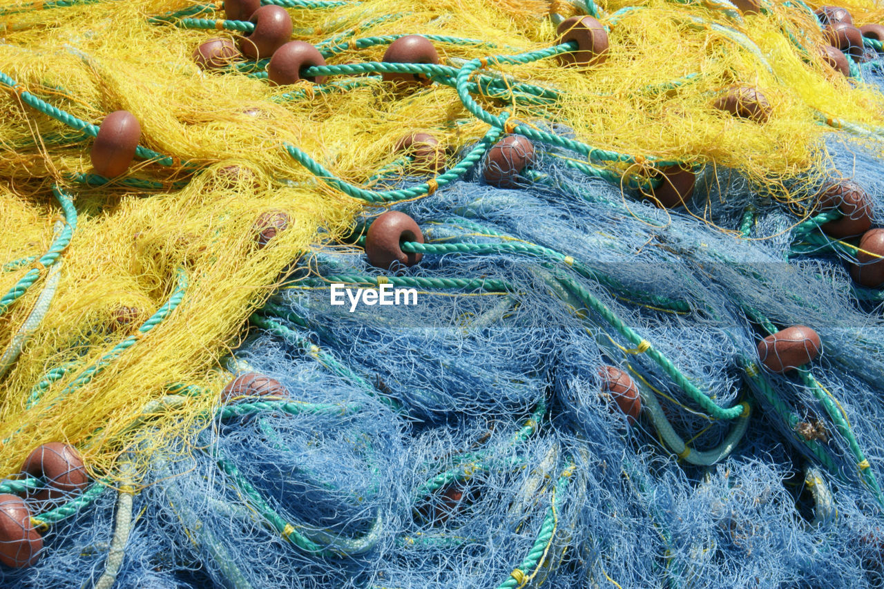 fishing net, fishing industry, fishing equipment, high angle view, rope, fishing tackle, buoy, day, no people, fishing, outdoors, close-up