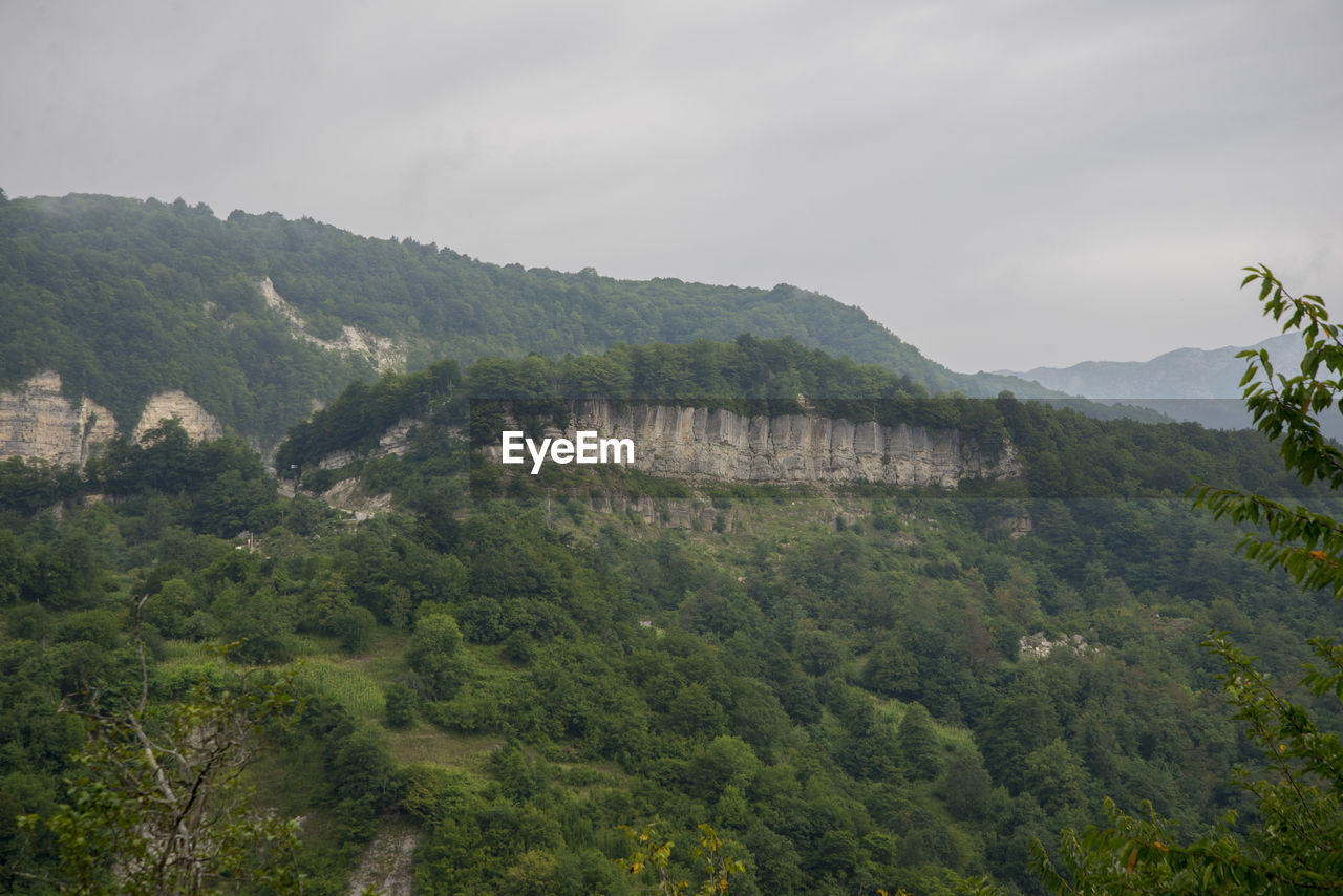 SCENIC VIEW OF MOUNTAIN AGAINST SKY