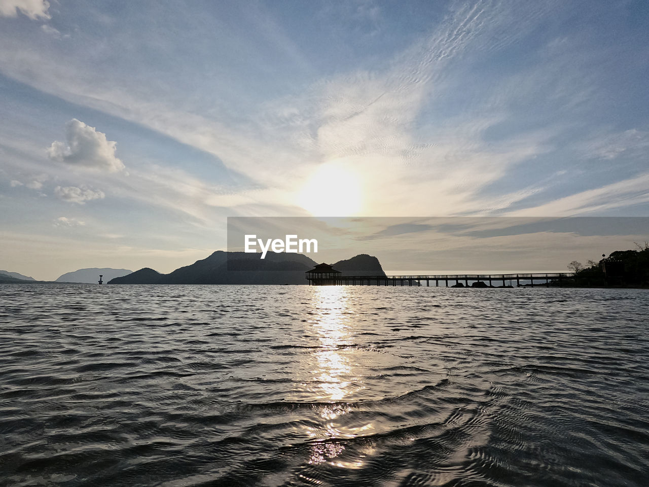 water, sky, horizon, sea, scenics - nature, beauty in nature, cloud, ocean, nature, shore, reflection, dusk, body of water, sunset, land, tranquility, coast, travel destinations, tranquil scene, travel, environment, sunlight, landscape, beach, mountain, outdoors, no people, wave, bay, evening, sun, seascape, trip, holiday, vacation, idyllic, blue, tourism, island, summer, day, rippled