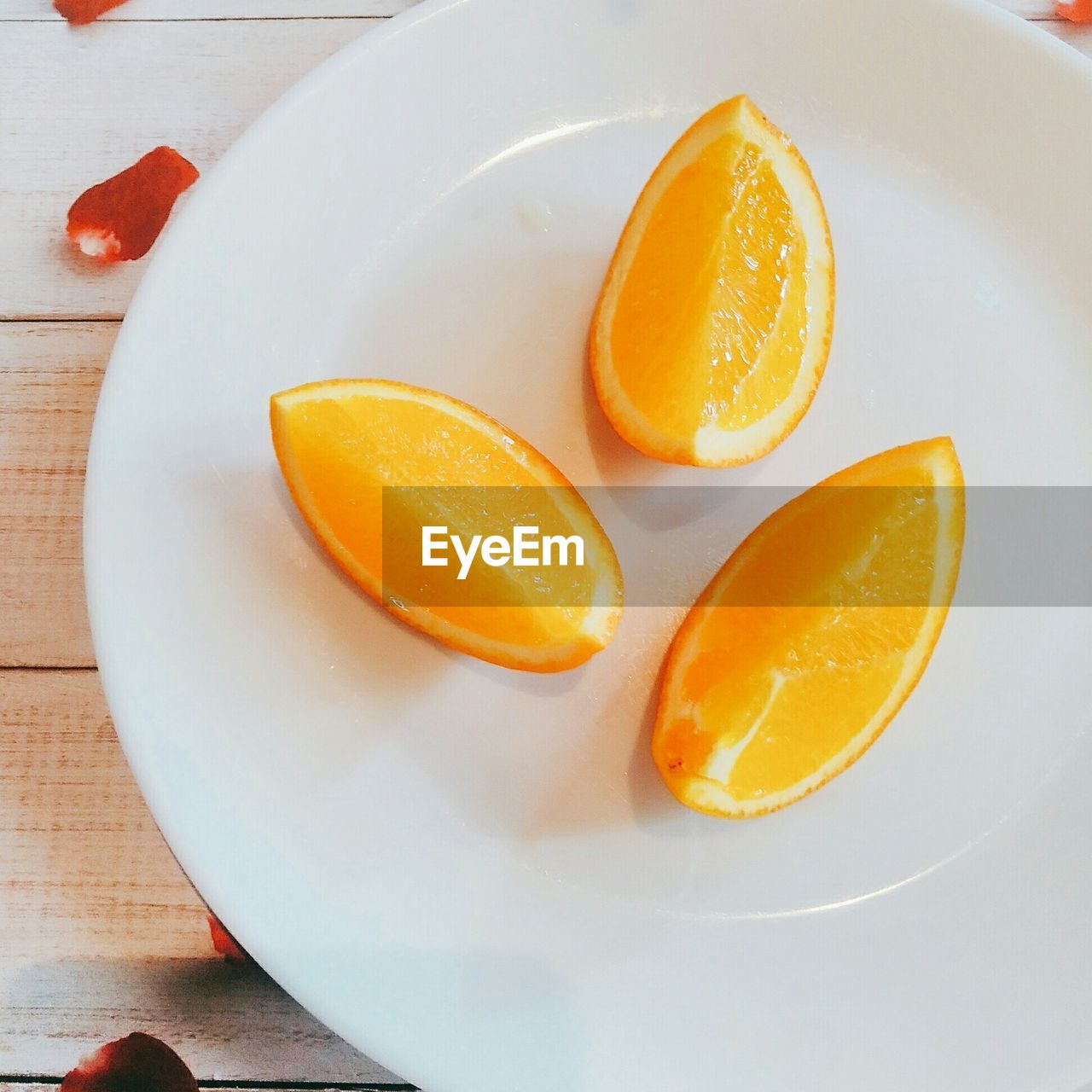 High angle view of orange slices in plate on table