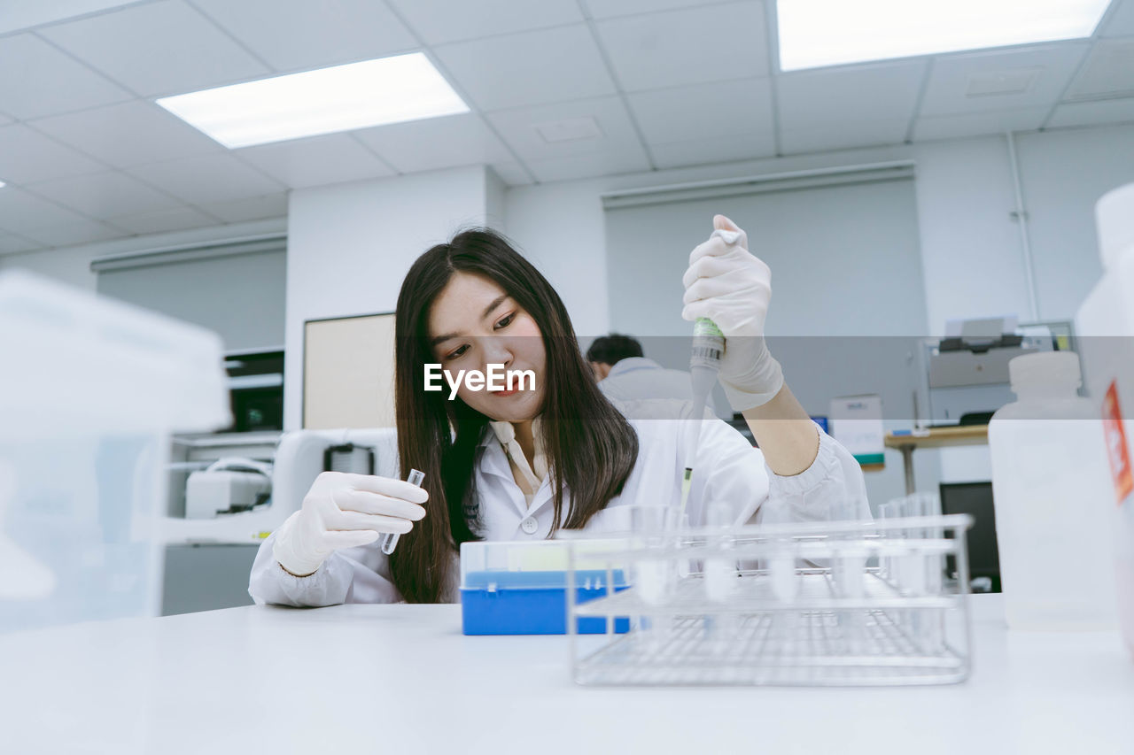 Scientist holding test tube at laboratory